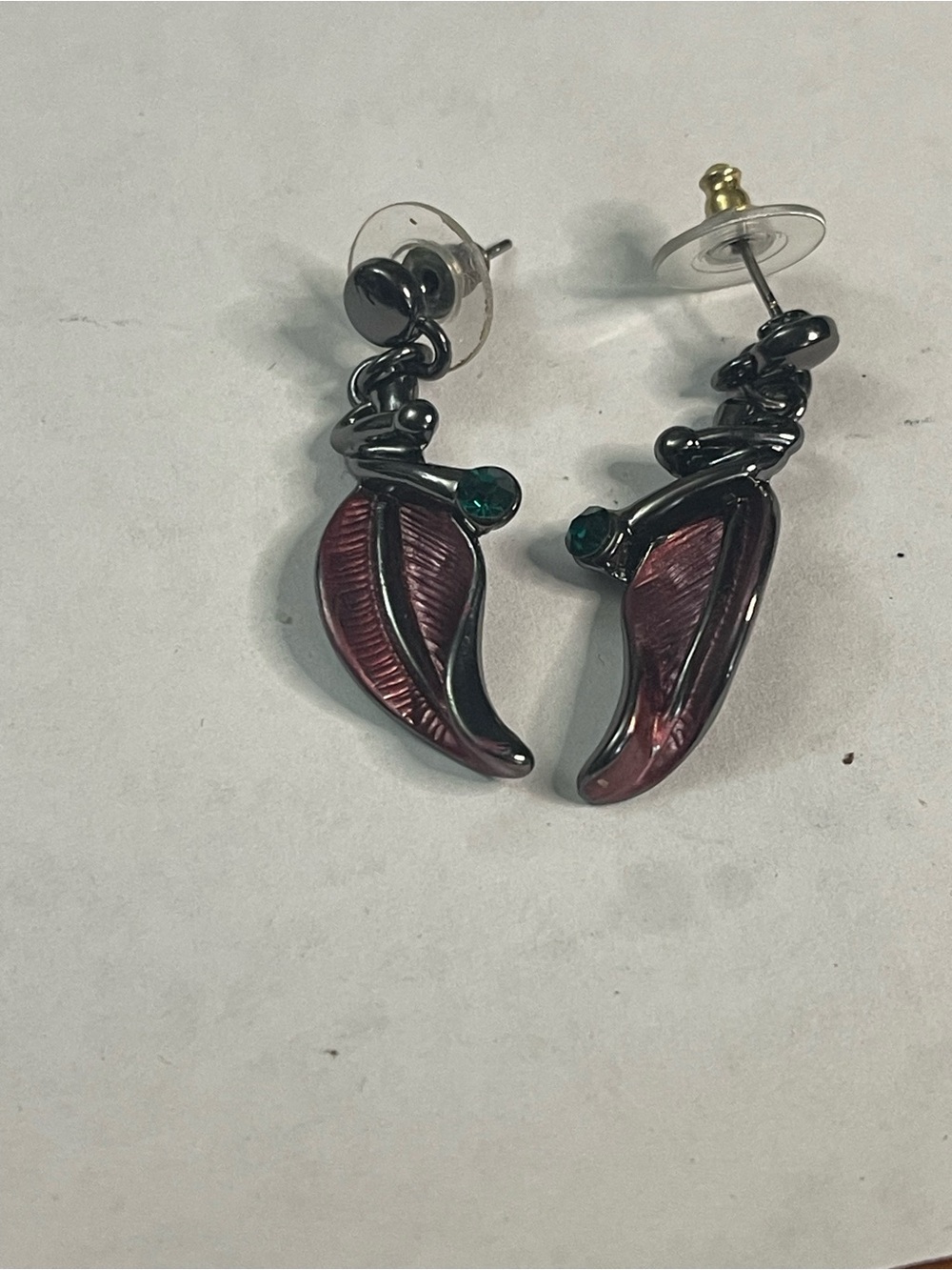 Ombré leaf-shaped dangle earrings with green rhinestone accent